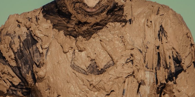 man in brown and black crew neck shirt